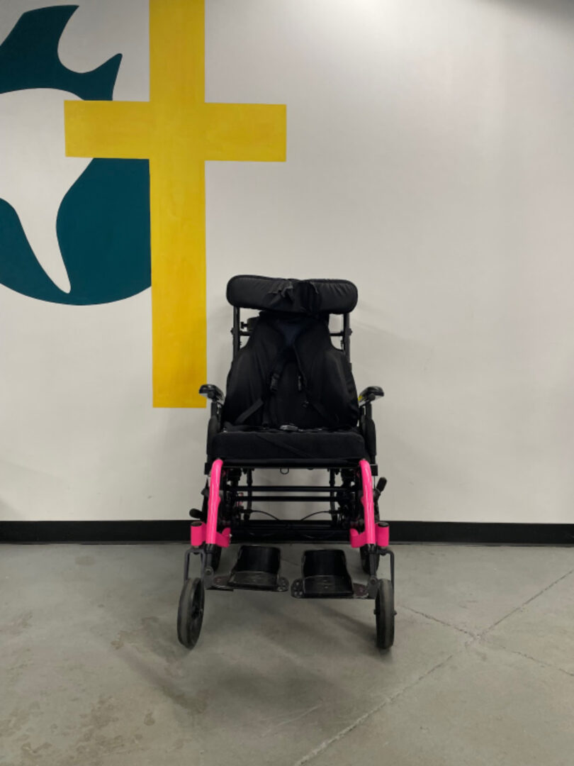 The Back View of a Wheel Chair in Black Color Image