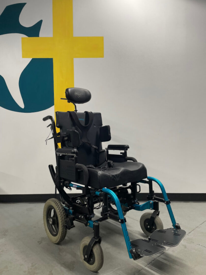 The Side View of a Wheel Chair in Black Color Blue Details