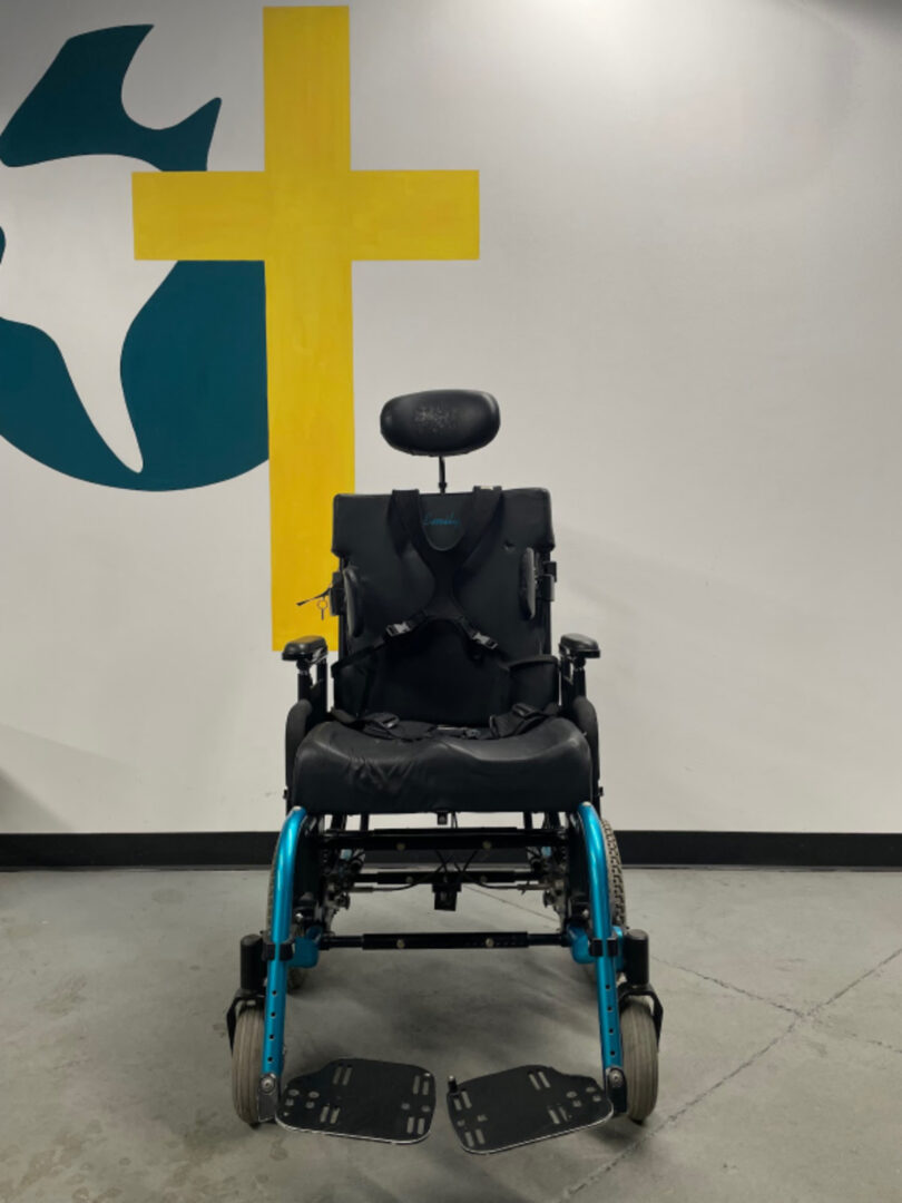 The Side View of a Wheel Chair in Black Color Blue Details