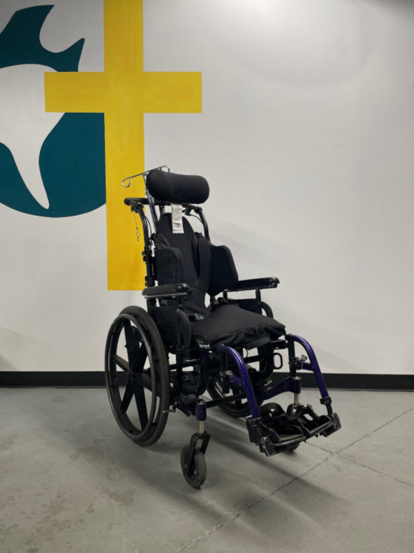 The Cross View of a Wheel Chair in Black Color Image