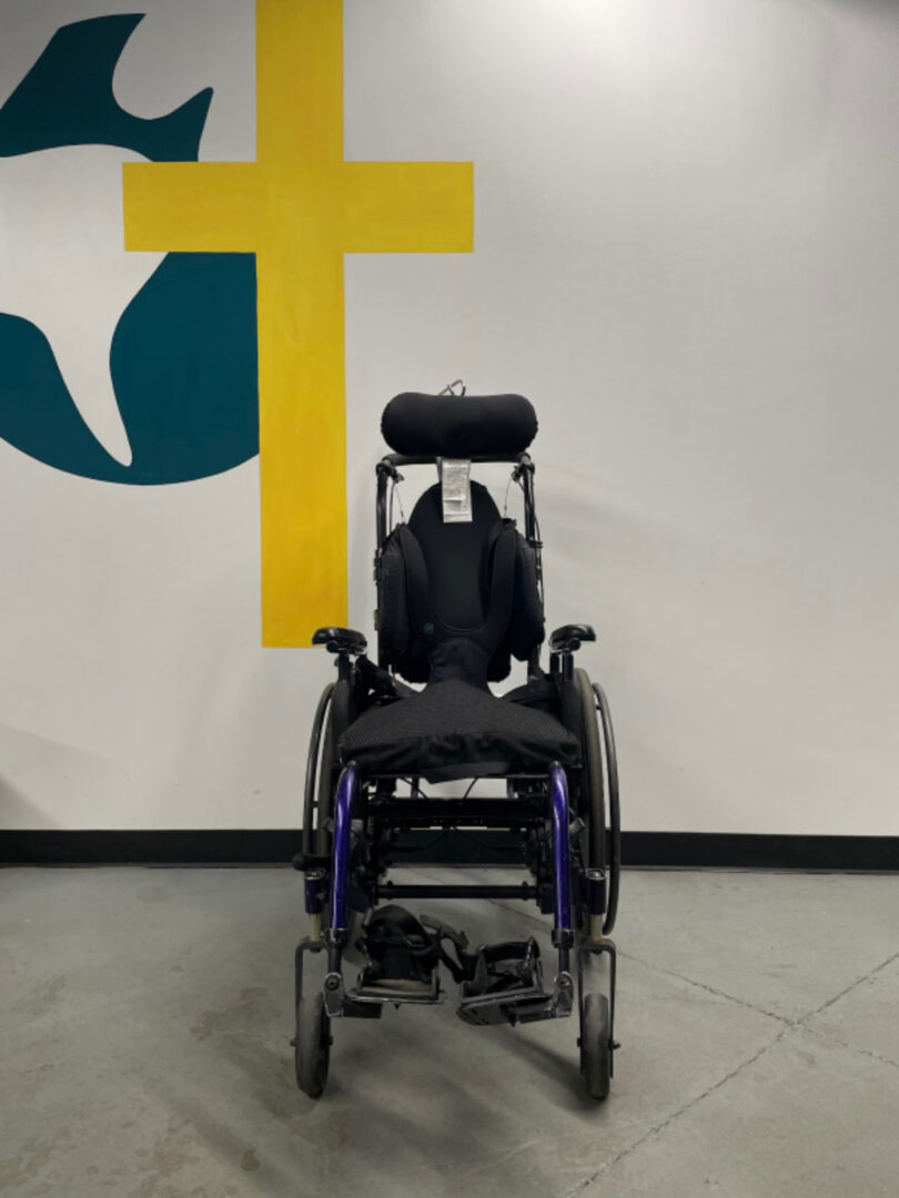 The Front View of a Wheel Chair in Black Color Image