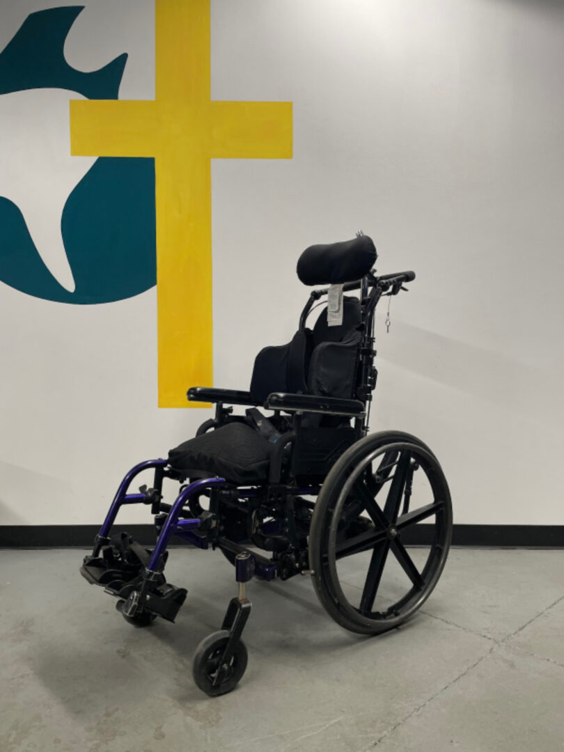 The Side View of a Wheel Chair in Black Color Image